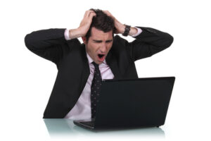 Man shouting at laptop